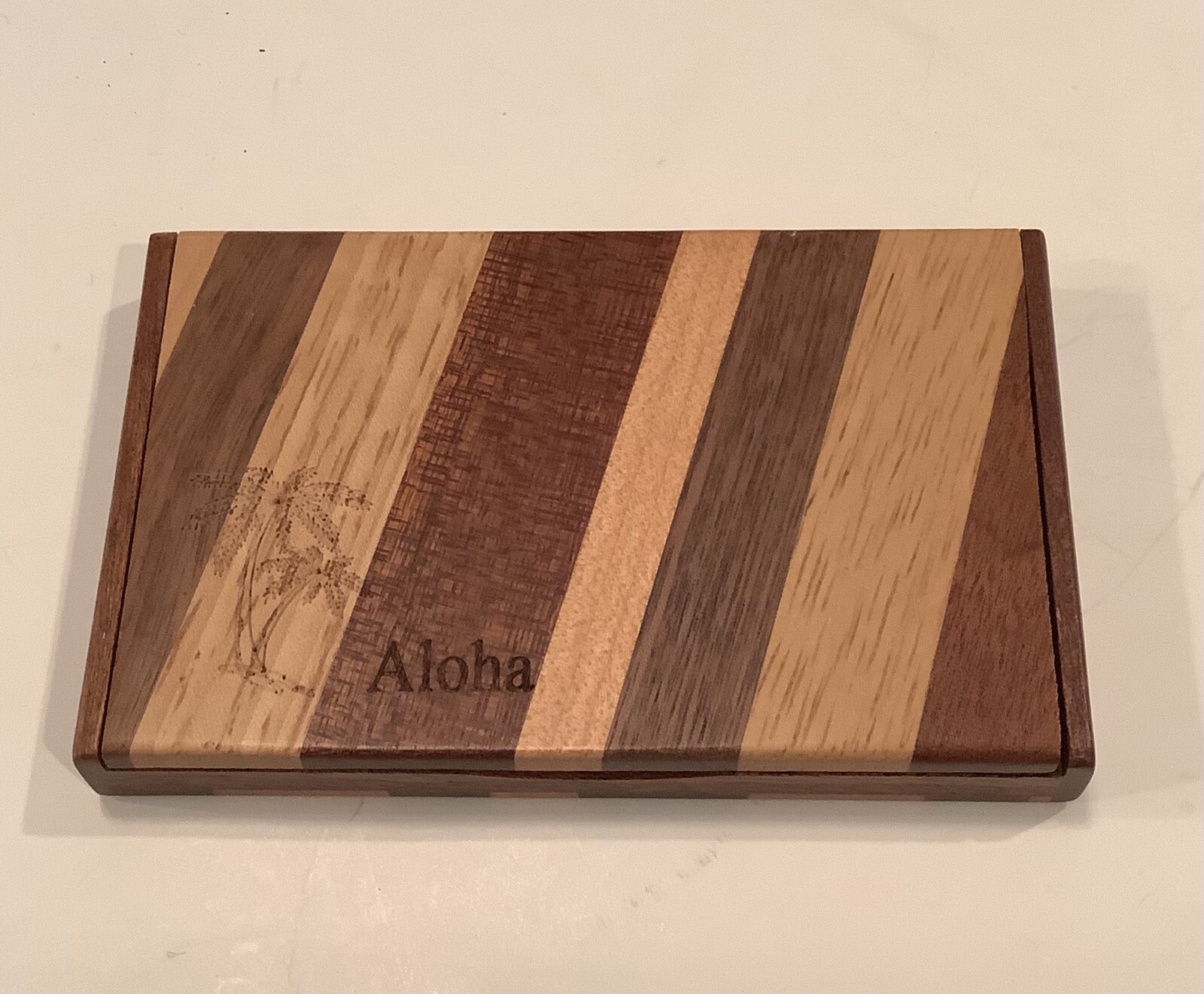 MIXED WOOD BUSINESS CARD HOLDER THAT SAYS ALOHA