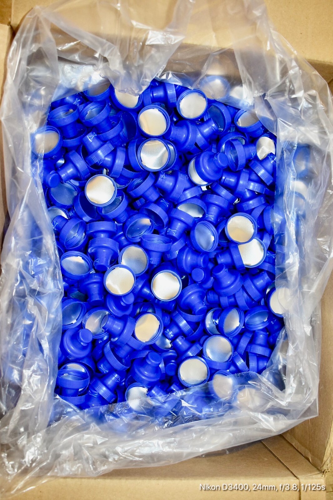 Aptar-38-400 Blue Flip Top Tab Caps with valve. Quantity 1200 per box