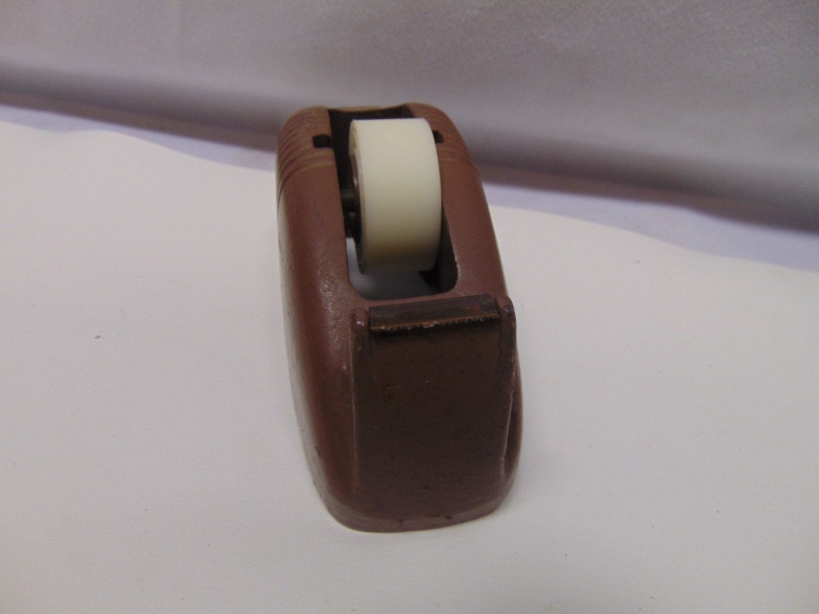 vintage Original solid metal brown manual take dispenser weighs 3 pounds 5″ x 2″